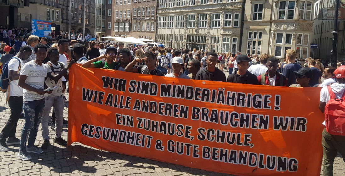 A group of protestors holding a banner.